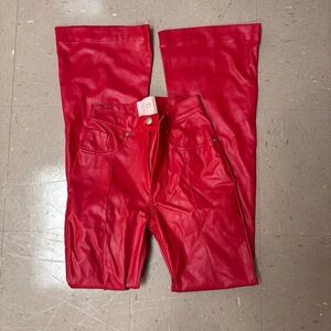 Red leather flare pants with star on the butt